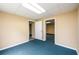 Basement room featuring neutral paint, carpeting, and doorways to connect to other rooms at 2055 Springer Walk, Lawrenceville, GA 30043