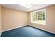 Basement room featuring neutral paint, carpeting, and a window looking to the yard at 2055 Springer Walk, Lawrenceville, GA 30043