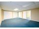 Spacious basement area with neutral paint, carpet, multiple closets, and doorways to other rooms at 2055 Springer Walk, Lawrenceville, GA 30043