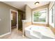 Bathroom featuring a soaking tub, glass shower, and tile flooring at 2055 Springer Walk, Lawrenceville, GA 30043