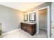 Bathroom featuring a double sink vanity with granite counters and tile flooring at 2055 Springer Walk, Lawrenceville, GA 30043