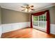 Dining room with hardwood floors, decorative trim, and a large window providing ample natural light at 2055 Springer Walk, Lawrenceville, GA 30043