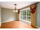Dining room with wood floors, a chandelier and large window at 2055 Springer Walk, Lawrenceville, GA 30043