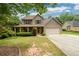 Charming two-story home with a covered front porch and well-maintained landscaping, offering great curb appeal at 2055 Springer Walk, Lawrenceville, GA 30043