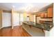 Open kitchen with a large granite island counter and wood floors at 2055 Springer Walk, Lawrenceville, GA 30043