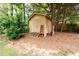 Exterior view of the backyard outbuilding with steps and neutral color at 2055 Springer Walk, Lawrenceville, GA 30043