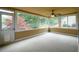 Enclosed sunroom with large windows, neutral paint, ceiling fan, and direct access to the yard at 2055 Springer Walk, Lawrenceville, GA 30043