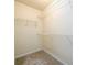 Walk-in closet featuring carpeted floors and metal shelving at 2055 Springer Walk, Lawrenceville, GA 30043