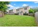 Wide backyard featuring mature trees, green grass and a patio with pergola at 216 Diamond Valley Pass, Canton, GA 30114