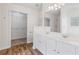 Bathroom features double sink vanity, walk-in closet, and shower at 216 Diamond Valley Pass, Canton, GA 30114