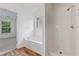 Bright bathroom featuring shower, and garden tub at 216 Diamond Valley Pass, Canton, GA 30114