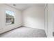 Bedroom with neutral carpet, large window and closet at 216 Diamond Valley Pass, Canton, GA 30114