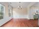 Elegant dining room with hardwood floors, large windows, and classic chandelier at 216 Diamond Valley Pass, Canton, GA 30114