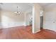 Open dining area with hardwood floors, wainscoting, and view to kitchen at 216 Diamond Valley Pass, Canton, GA 30114