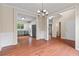 Spacious dining area adjacent to kitchen with hardwood floors and neutral decor at 216 Diamond Valley Pass, Canton, GA 30114