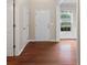 Clean entryway with hardwood floors, white trim, and natural light from the window at 216 Diamond Valley Pass, Canton, GA 30114