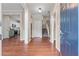 Bright foyer with hardwood floors, staircase, and access to the kitchen at 216 Diamond Valley Pass, Canton, GA 30114