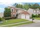 Charming two-story home with brick accents and manicured lawn at 216 Diamond Valley Pass, Canton, GA 30114