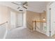 Upstairs hallway with neutral walls, white doors, and carpet flooring at 216 Diamond Valley Pass, Canton, GA 30114