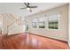 Bright living room featuring hardwood floors, large windows and a ceiling fan at 216 Diamond Valley Pass, Canton, GA 30114