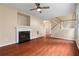 Living room featuring a fireplace, hardwood floors, access to the stairs, and natural light at 216 Diamond Valley Pass, Canton, GA 30114