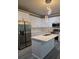 Bright kitchen with an island, stainless steel appliances, and pristine white cabinetry at 3368 Bonnes Ct, Ellenwood, GA 30294