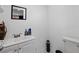 Bathroom with white vanity, sink, and decorative accents at 3999 Wabash Ln, Ellenwood, GA 30294