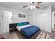 Comfortable bedroom featuring a ceiling fan, hardwood floors, and a contemporary area rug at 3999 Wabash Ln, Ellenwood, GA 30294