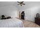 Spacious bedroom featuring wood floors, ceiling fan, and adjacent doors leading to more rooms at 3999 Wabash Ln, Ellenwood, GA 30294