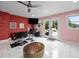 Unique bonus room with salon chairs, vanity, TV, and a walk out door at 3999 Wabash Ln, Ellenwood, GA 30294