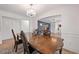 Elegant dining room featuring hardwood table with classic chandelier and arched entryway at 3999 Wabash Ln, Ellenwood, GA 30294