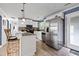Well-lit kitchen with stainless appliances, white cabinets, and modern breakfast bar at 3999 Wabash Ln, Ellenwood, GA 30294