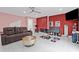 Living area with a brown couch, decorative accents, and modern flooring at 3999 Wabash Ln, Ellenwood, GA 30294