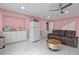 Living room with kitchenette, tile flooring, and comfortable seating at 3999 Wabash Ln, Ellenwood, GA 30294