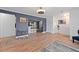 Hardwood floors leading through the main living area, into dining, kitchen and staircase at 3999 Wabash Ln, Ellenwood, GA 30294