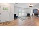 Open living area with hardwood floors, modern lighting, and decorative blue chairs at 3999 Wabash Ln, Ellenwood, GA 30294