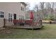 Outdoor deck with ample seating and a grill, ideal for entertaining and relaxing outdoors at 8871 Jimmy Lee Cir, Jonesboro, GA 30238