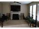 Spacious living room featuring a cozy fireplace, bright windows, and plenty of space at 8871 Jimmy Lee Cir, Jonesboro, GA 30238