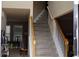Inviting staircase with carpet steps and wooden railings provides access to the upper level at 8871 Jimmy Lee Cir, Jonesboro, GA 30238