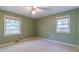View of an empty bedroom showcasing natural light from two windows on a beautiful, sunny day at 2783 Mount Olive Dr, Decatur, GA 30033