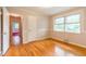 A bedroom featuring hardwood floors, decorative wall trim, interior door, and ample space at 2783 Mount Olive Dr, Decatur, GA 30033