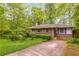 Charming brick ranch-style home with a well-maintained front yard and mature trees at 2783 Mount Olive Dr, Decatur, GA 30033