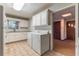 Well-lit kitchen including modern appliances, a washer, and a dryer at 2783 Mount Olive Dr, Decatur, GA 30033