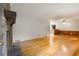 Cozy living room featuring hardwood floors and a classic brick fireplace at 2783 Mount Olive Dr, Decatur, GA 30033