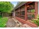 Inviting screened porch with wood flooring provides a relaxing outdoor living space at 2783 Mount Olive Dr, Decatur, GA 30033