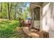 An outdoor space surrounded by lush greenery, a wooden deck, and a serene view of nature at 488 Russell Rd, Lawrenceville, GA 30043