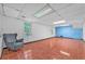 Spacious basement featuring tiled floors, pot lights, and a painted accent wall at 488 Russell Rd, Lawrenceville, GA 30043