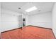 Unfinished basement with tile flooring and open space, leading to stairs at 488 Russell Rd, Lawrenceville, GA 30043
