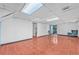 Spacious basement with tile flooring, white walls, and access to the outdoors at 488 Russell Rd, Lawrenceville, GA 30043