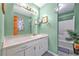 Bathroom with a mirror and modern vanity at 488 Russell Rd, Lawrenceville, GA 30043